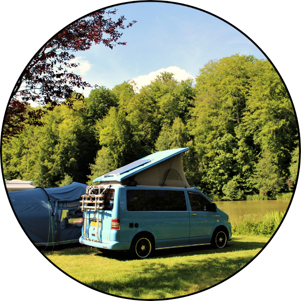 Grass camping pitches by a lake and forest at Castel Camping Le Brévedent in Normandy near Lisieux and Deauville Camping in Normandy by a lake at Camping Le Brévedent